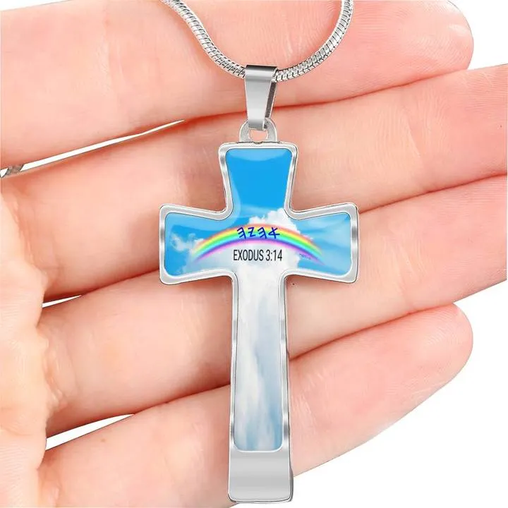 A person holding a symbolic cross featuring a vibrant rainbow as Ahayah's promise
